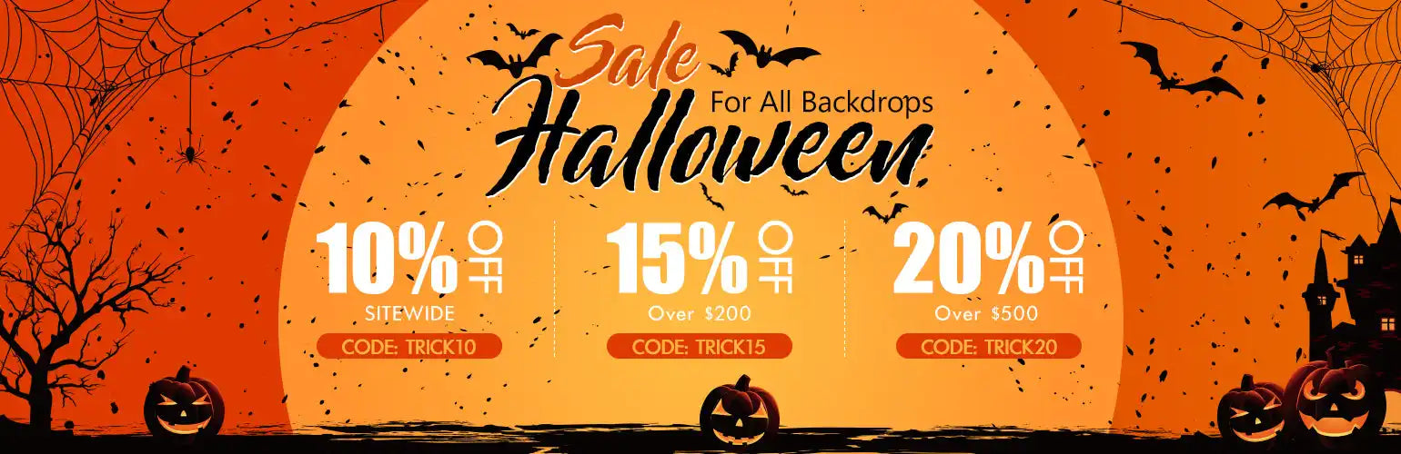 Orange pumpkin lantern backdrop with black bats and spiders.